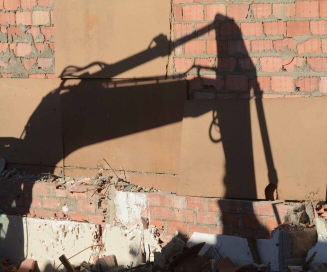 shadow of a digger on the wall